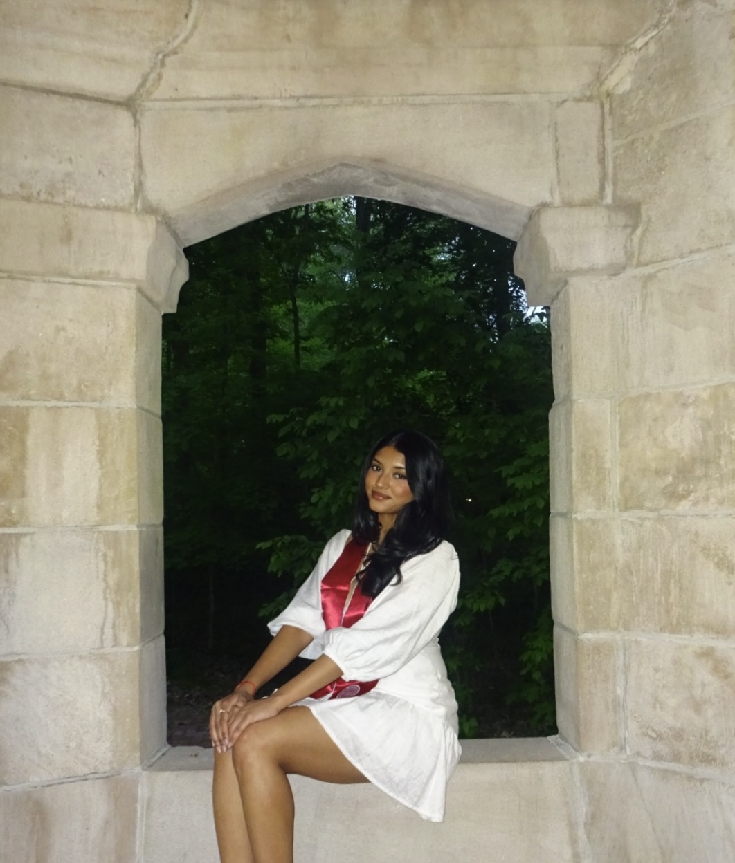 Vibha Ragothaman wearing her graduation stole on the Indiana University campus